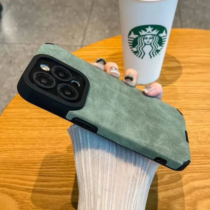 Luxury suede phone cover in green with a smooth suede case texture, offering an elegant premium look and dependable protective fit.
