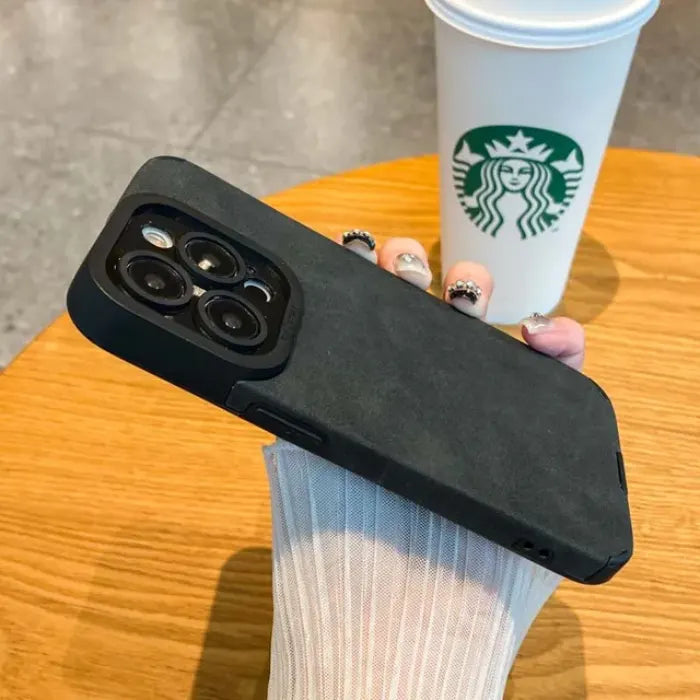 Luxury suede phone cover in matte black featuring a minimalist textured finish and premium protective case structure for everyday use.