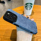 Luxury suede phone cover in blue displayed on a hand, showing a premium textured finish and protective phone case style for daily use.