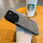 Luxury suede phone cover in grey shown on a hand, featuring a premium textured case design and protective build for daily use.