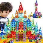 Magnetic building blocks assembled into a vibrant multicolor castle by young child with focus and creativity