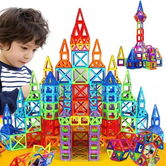Magnetic building blocks assembled into a vibrant multicolor castle by young child with focus and creativity