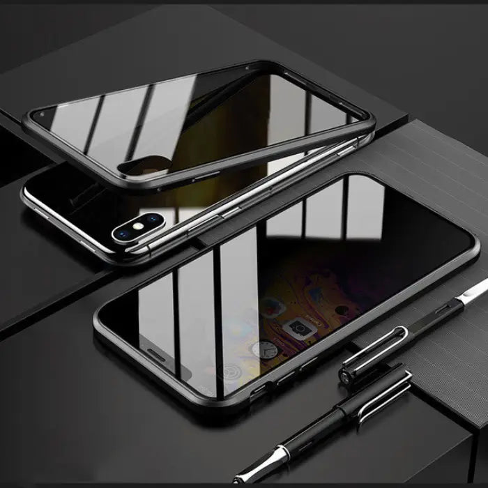 Shockproof magnetic iPhone case with a black frame and glowing accents on a modern desk.