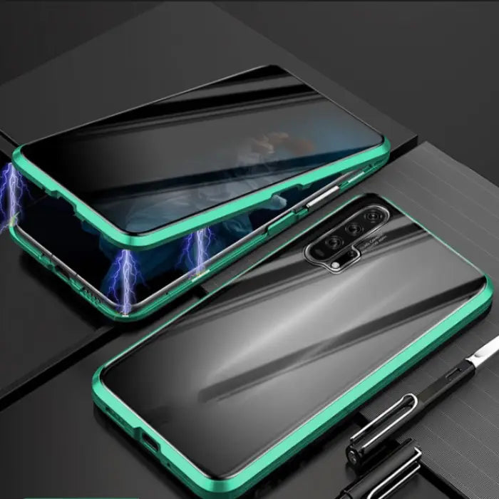 Shockproof magnetic iPhone case with a green metallic frame and glowing accents on a modern desk.