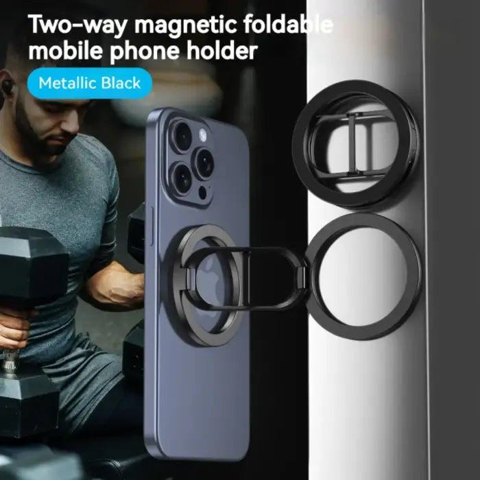 Magnetic phone holder in metallic black attached to phone while man lifts weights in background.