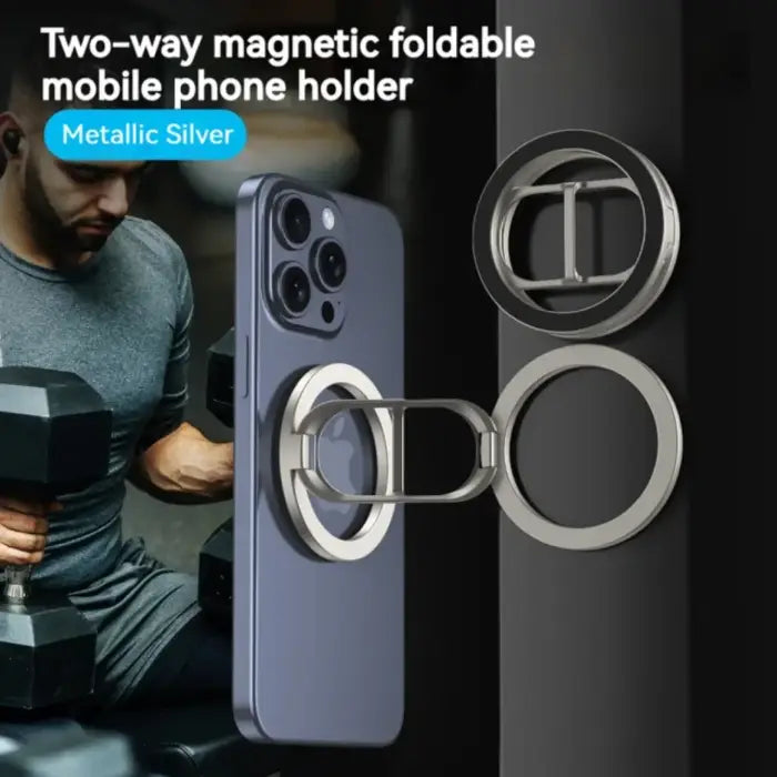 Magnetic phone holder in metallic silver color mounted on phone with gym setting in background.