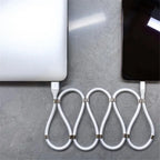 magnetic self coiling usb c charging cable shaped in perfect round coil with magnetic clips for clean cable organization