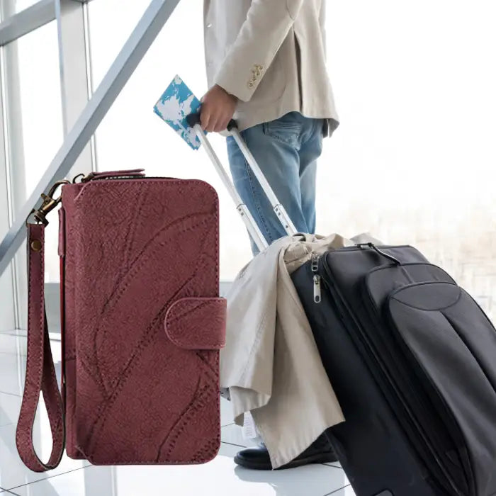 Magnetic wallet case perfect for travel with wristlet strap, compact design and easy access to travel documents while at the airport