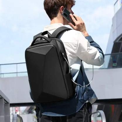  Man wearing sleek black geometric backpack while using smartphone outdoors in urban setting