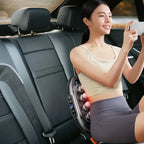 Massage Gun back massager used in a car seat, delivering powerful 16-head deep pressure for travel-friendly back pain relief