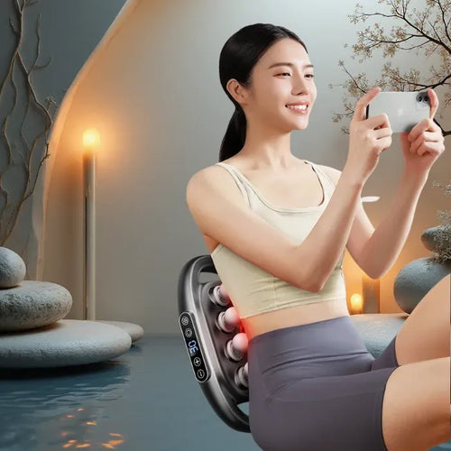 Massage Gun back device used by a woman relaxing indoors, showing heated deep tissue action for soothing muscle relaxation