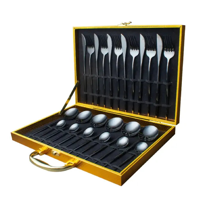 Complete matte black flatware set in gold-trimmed display case