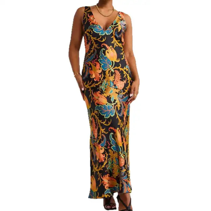 Maxi dress with black base and bold floral print, featuring deep V neckline and sleeveless design.