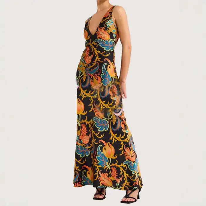 Maxi dress with colorful floral patterns on black satin, flattering V neckline, and elegant fit.