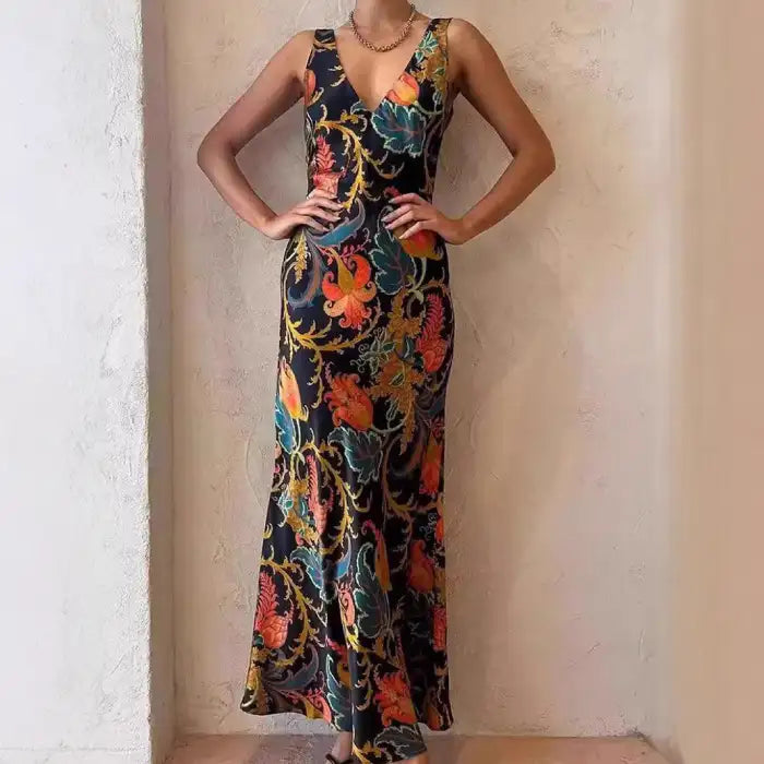 Maxi dress in satin with vivid floral print, fitted silhouette, and plunging neckline for evening wear.