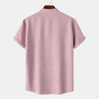 Men's blouse maroon plain fabric with short sleeves and rolled cuffs back view on hanger
