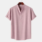 Men's blouse maroon plain fabric with short sleeves and rolled cuffs front view on hanger