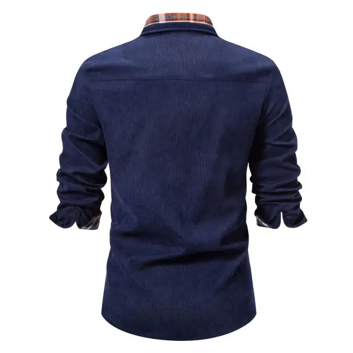 Men's casual plaid shirt in navy blue with orange and white plaid details, back view with rolled sleeves visible