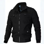  Mens cotton bomber jacket with collar in classic black displays zippered chest pockets, stand collar, and bomber style fit.