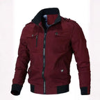 Mens cotton bomber jacket with collar in burgundy features zipper closure, chest pockets, and ribbed cuffs for casual style.