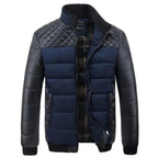 Mens insulated jacket in navy blue and black with diamond-quilted shoulders and padded sleeves.