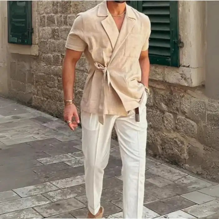  Men's plus size tied lightweight linen wrap top beige styled with white pants in street setting