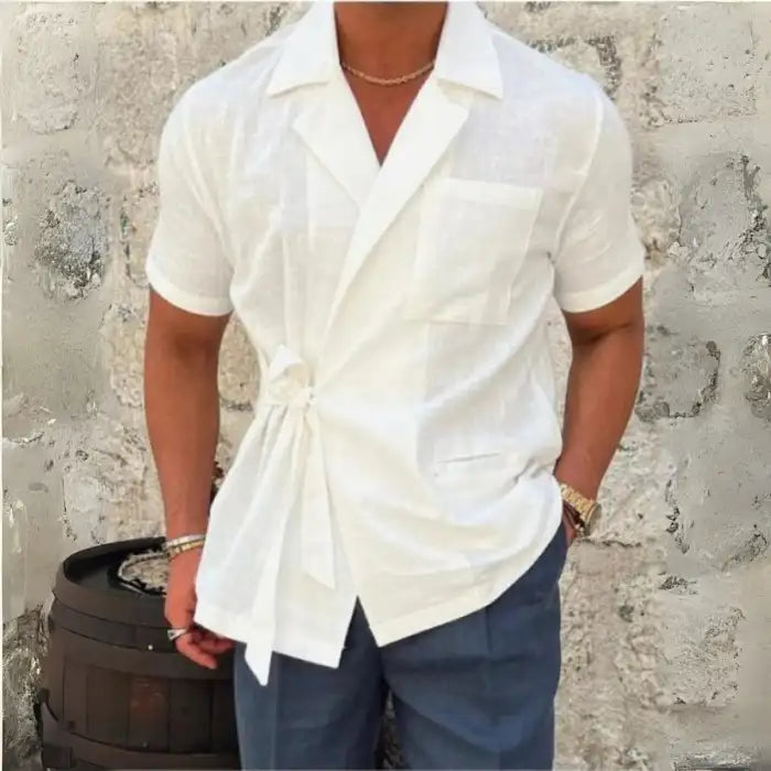  Men's plus size tied lightweight linen wrap top in white styled with navy pants and sandals