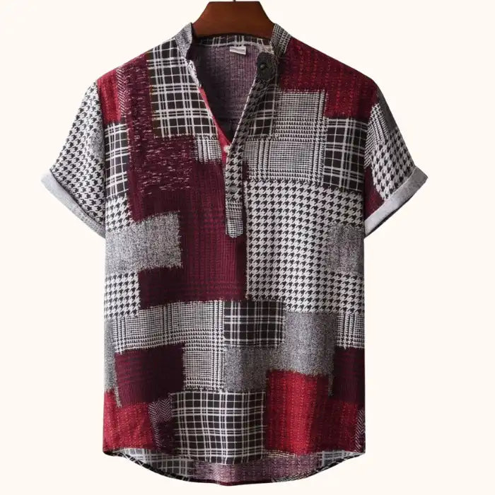 Men's plus size printed short sleeve blouse with patchwork pattern in red, black, and gray colors on hanger.