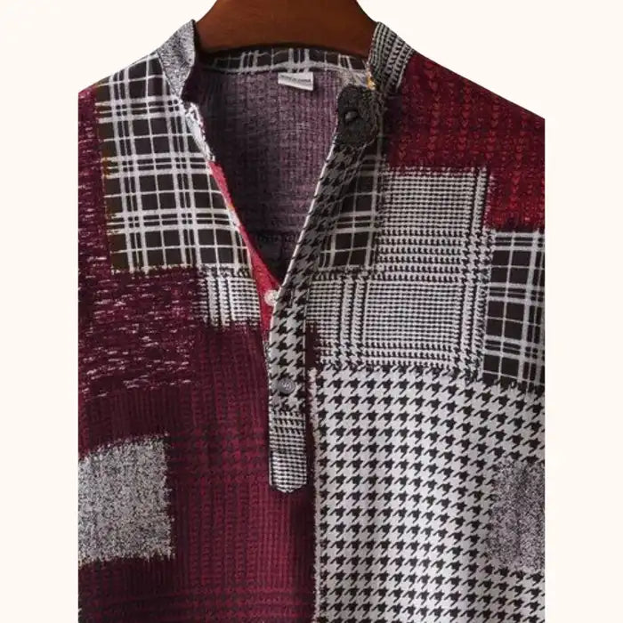 Close-up of men's plus size printed short sleeve blouse showing collar, button placket, and detailed patchwork fabric.