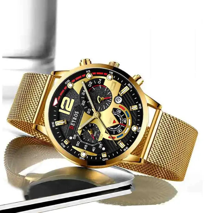 Men's watches gold stylish dial with chronograph on mesh band resting beside smartphone