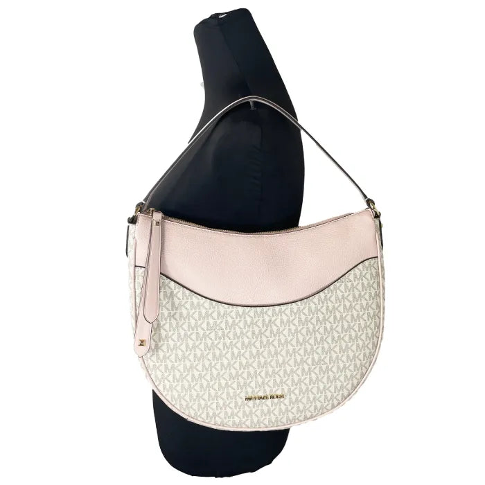 Michael Kors hobo styled on black display form showing wear position and strap drop length