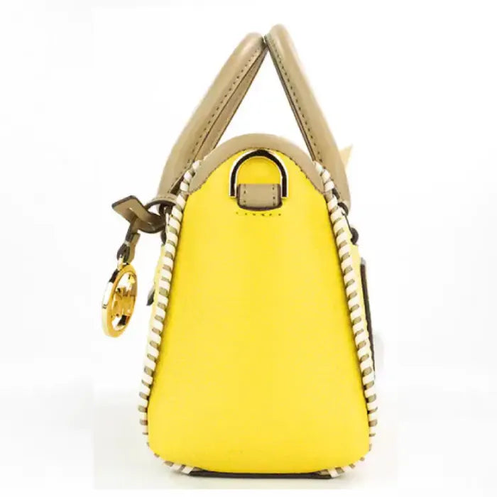 Side profile of Michael Kors yellow logo tote, highlighting structured design and leather accents.