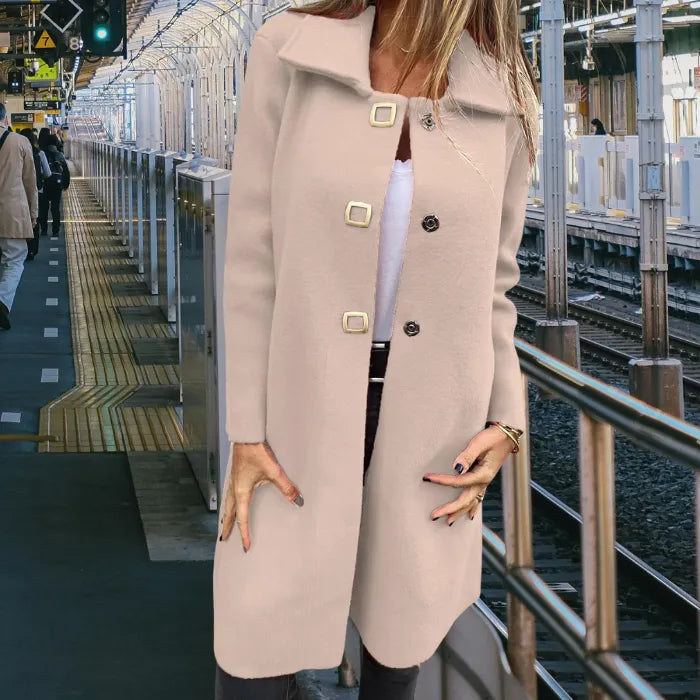 Mid length wool coat in classic beige featuring a structured silhouette and gold hardware, ideal for polished everyday wear.
