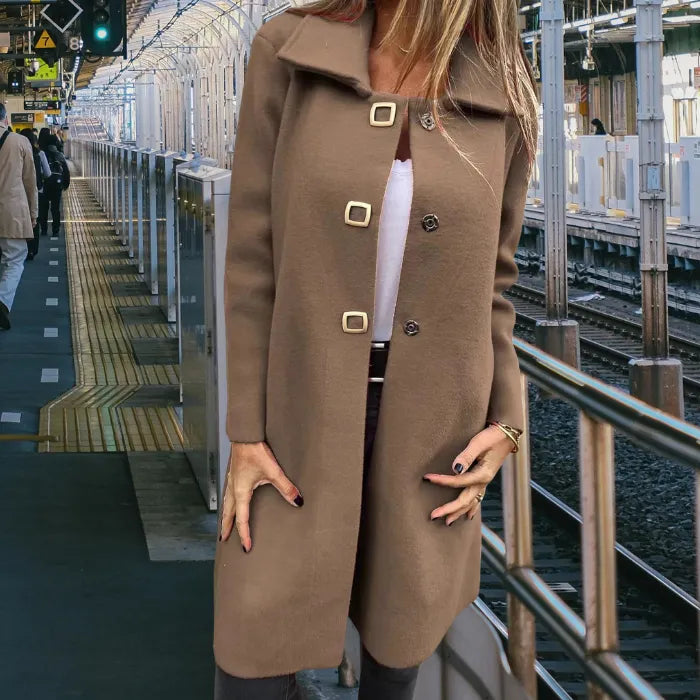 Mid length wool coat in classic brown with a smooth wool texture and tailored fit for versatile cold season wear.