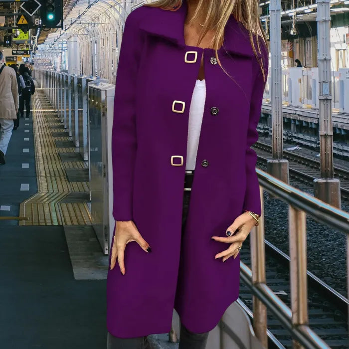 Mid length wool coat in deep purple offering a flattering mid length cut and eye catching color for standout winter looks.