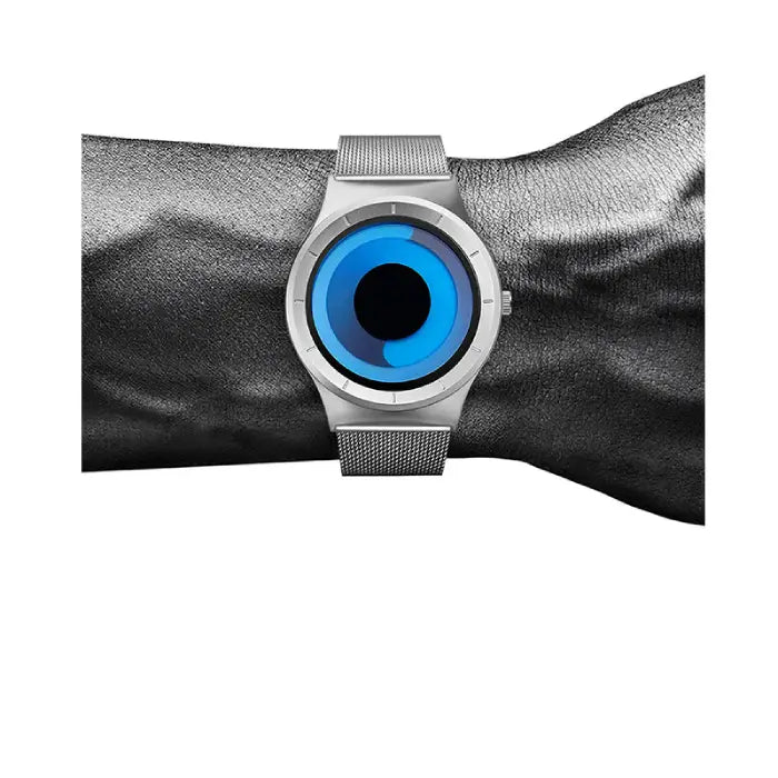 Minimalist blue dial watch in silver worn on wrist, highlighting its modern mesh strap and stylish unisex design ideal for daily outfits