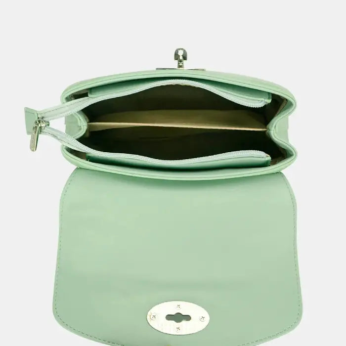 Open mint green handbag showing spacious interior compartments for organized storage and daily use.