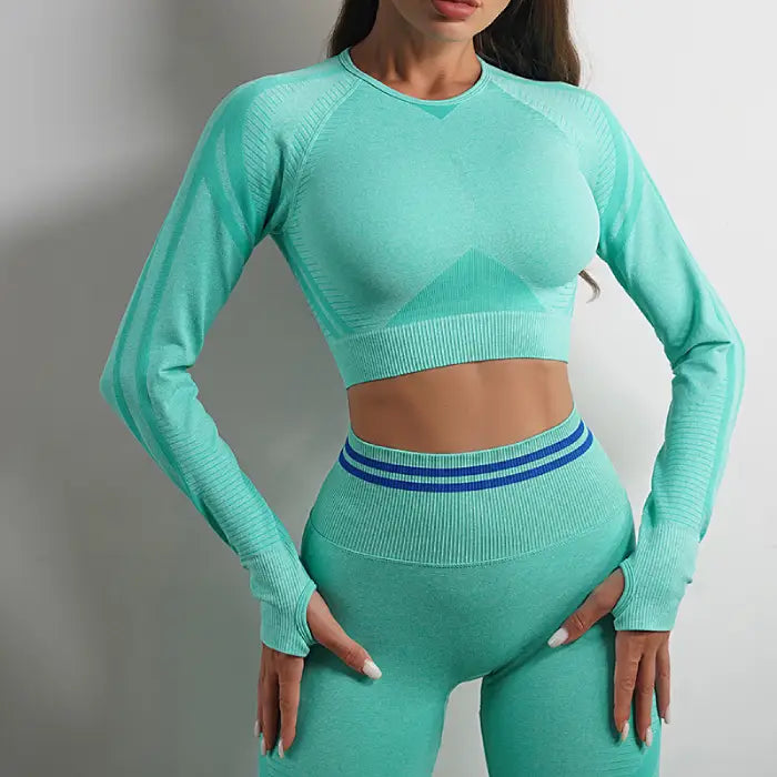  Mint green seamless activewear set for women with long sleeves and high-waisted yoga leggings.