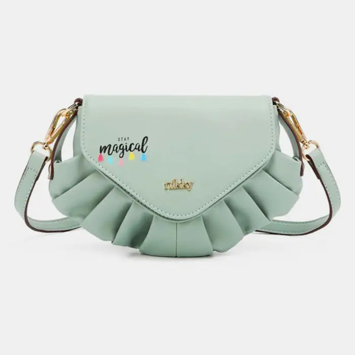 Stylish mint green pleated shoulder bag with stay magical text design, perfect for casual spring fashion accessories