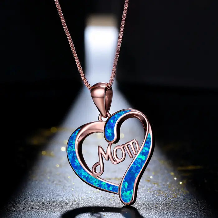 Romantic rose gold mom heart pendant with glowing blue opal details, perfect for meaningful gift occasions.