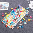 Montessori Math Board on grey carpet with scattered numbers, letters, rings, and fishing game pieces.