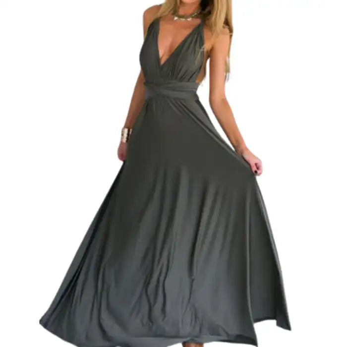  Multiway dress in charcoal gray with deep v-neckline and crisscross waist styled in flowy maxi cut.