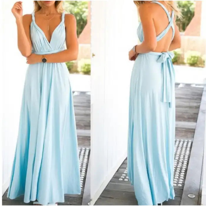 Multiway dress in light blue with pleated bust and crossback straps tied in a bow.