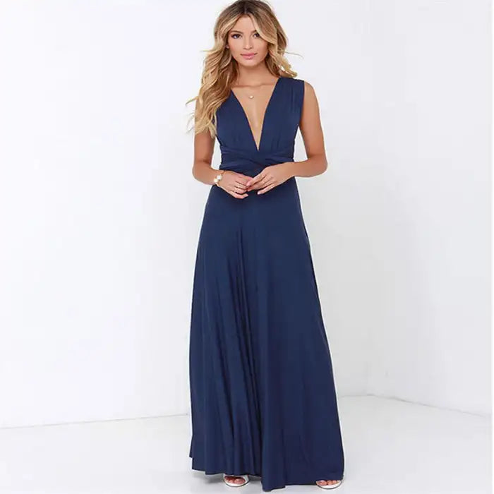  Multiway dress in navy blue featuring a deep v-neck and gathered waist with full-length flow.