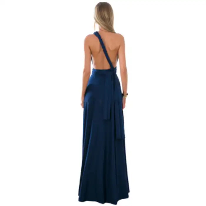 Multiway dress in navy styled one-shoulder with an open back and floor-length draped skirt.