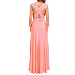 Multiway dress in peach with wide crossback straps and tied waist for an elegant backless look.