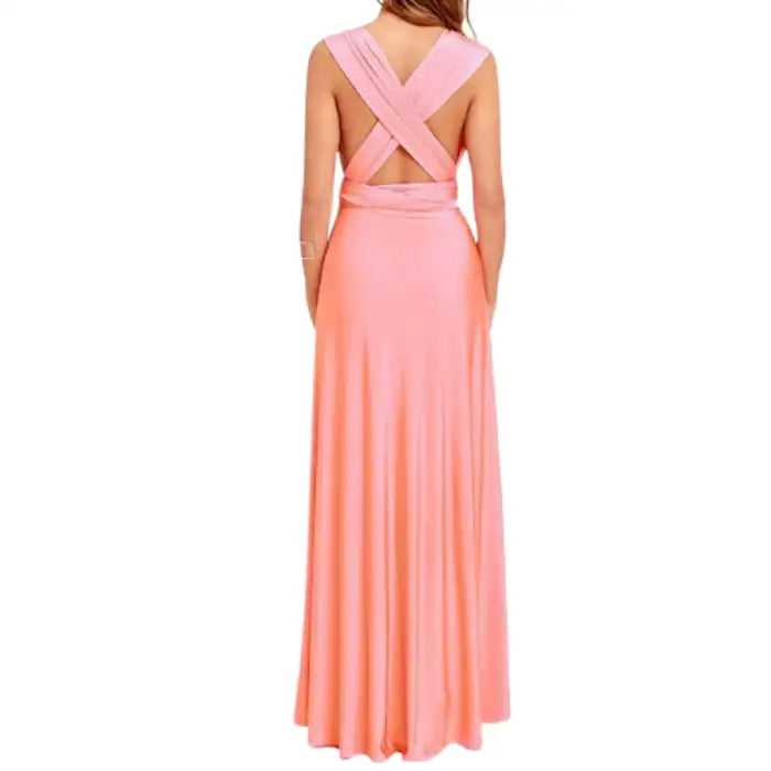 Multiway dress in peach with wide crossback straps and tied waist for an elegant backless look.
