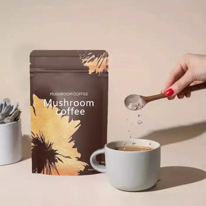 Mushroom coffee being poured into a cup with a wooden spoon.