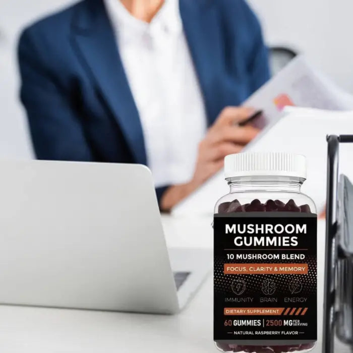 Mushroom gummies bottle on a desk with notebooks in a cozy home setting, promoting focus, clarity, and memory enhancement.