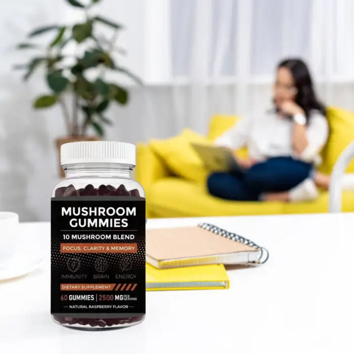 Mushroom gummies bottle on a professional desk setup, supporting productivity, focus, and mental clarity.